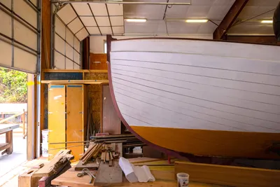 Students work with instructors at the Northwest School of Wooden Boatbuilding, in Port Townsend, Washington on July 25, 2023. The NSWB has been in operation of over 40 years, teaching students wooden boatbuilding skills and helping launch careers in that industry.